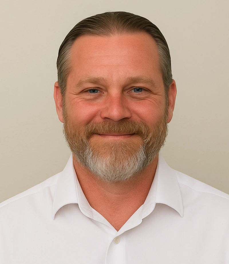 A man with a faux hawk haircut and an A-Team shirt.
